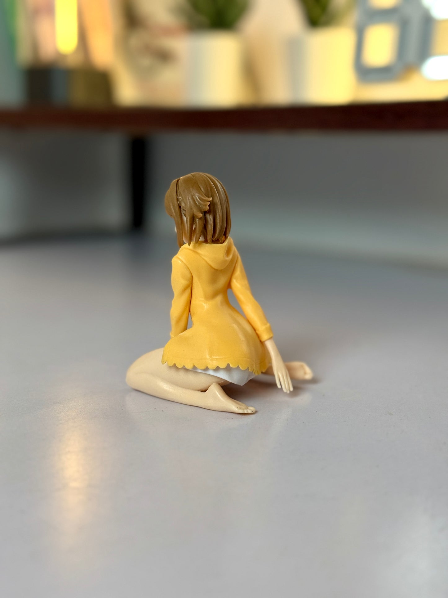 Anime Girl Figure – 9cm Collectible Statue in Yellow Cardigan Kneeling Pose
