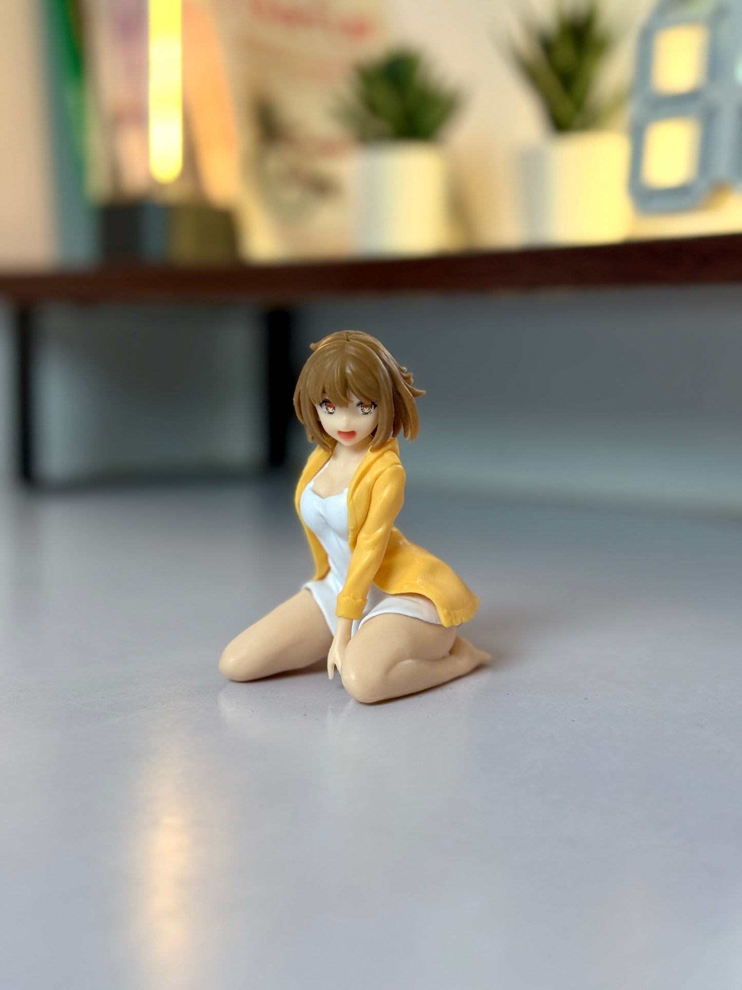 Anime Girl Figure – 9cm Collectible Statue in Yellow Cardigan Kneeling Pose