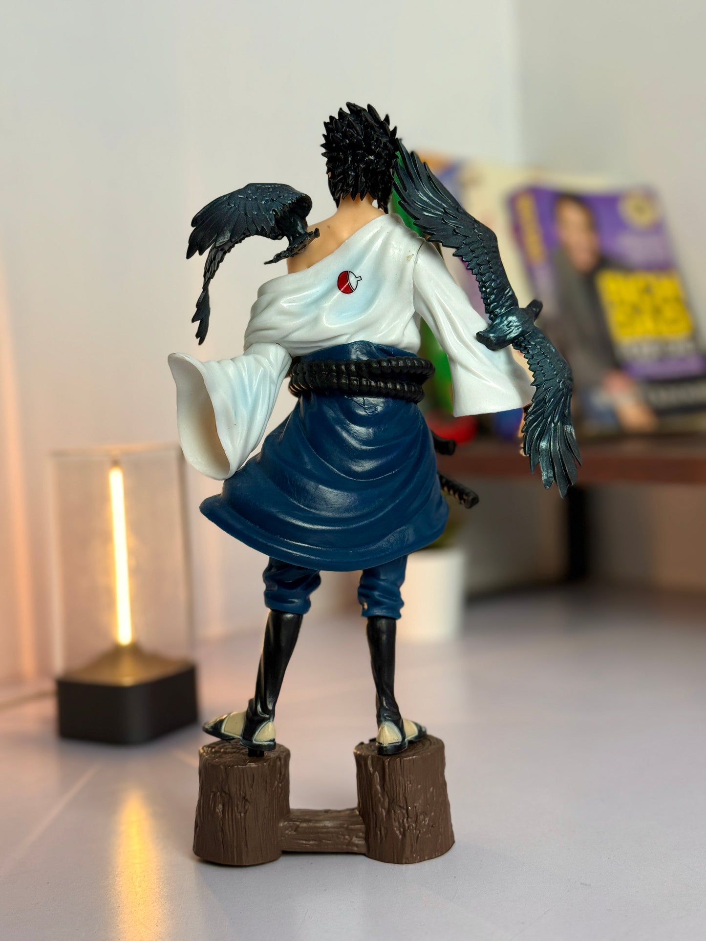 SASUKE STANDING ON WOOD